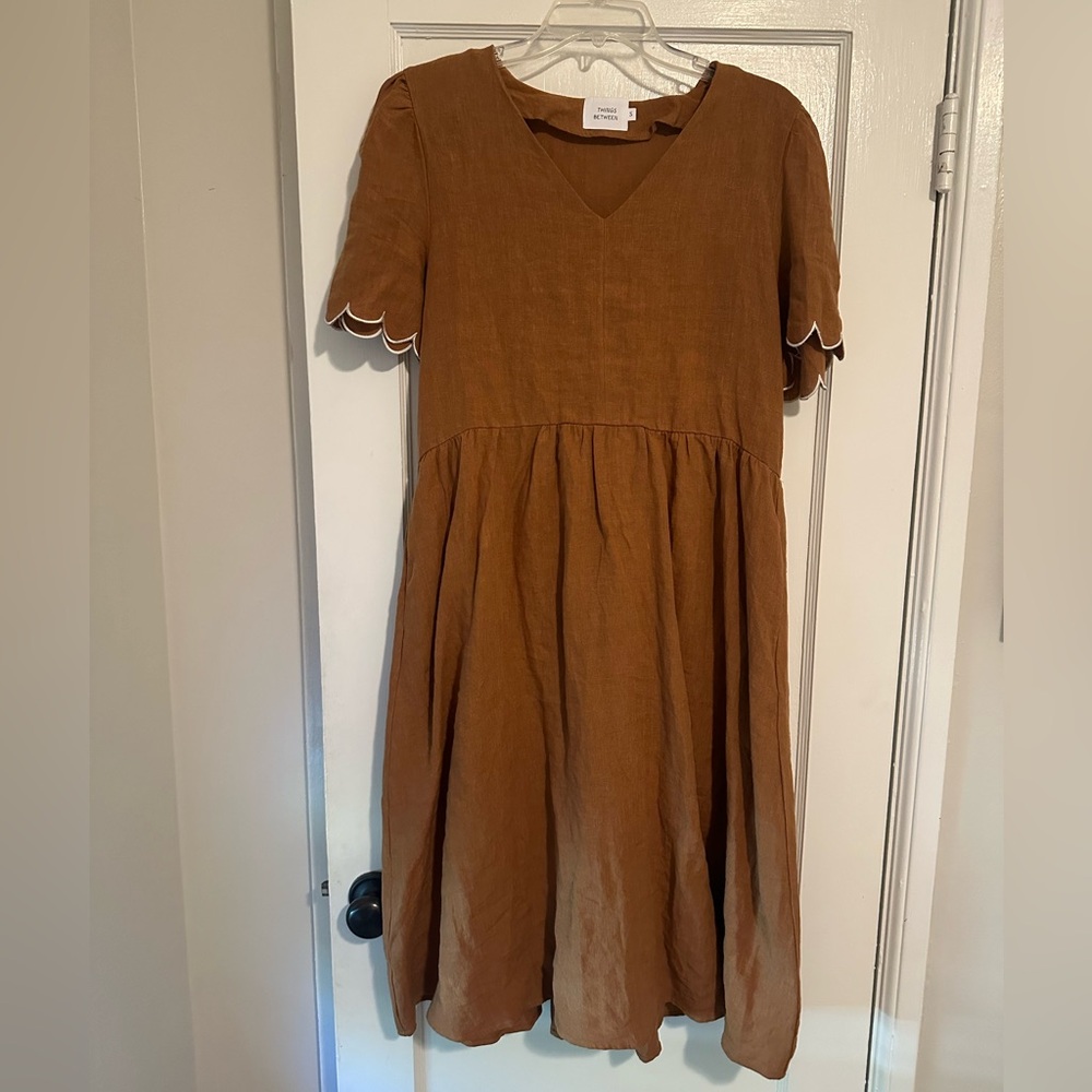 Brown linen dress with scallop detail